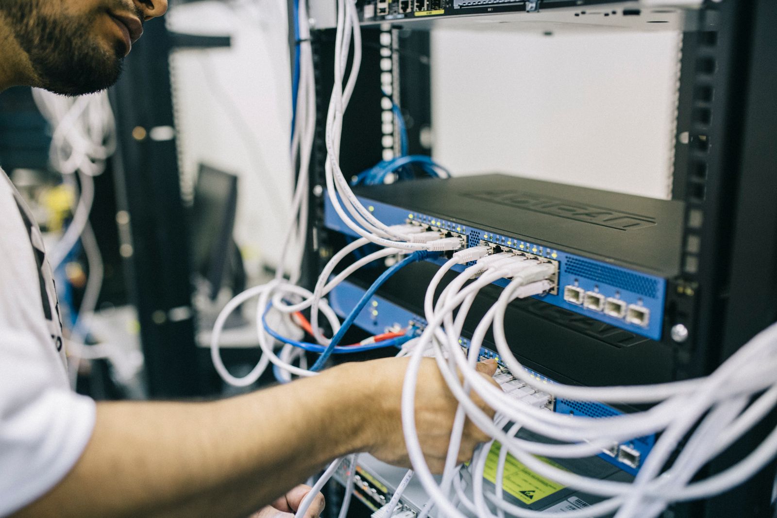Technician connecting managed network equipment